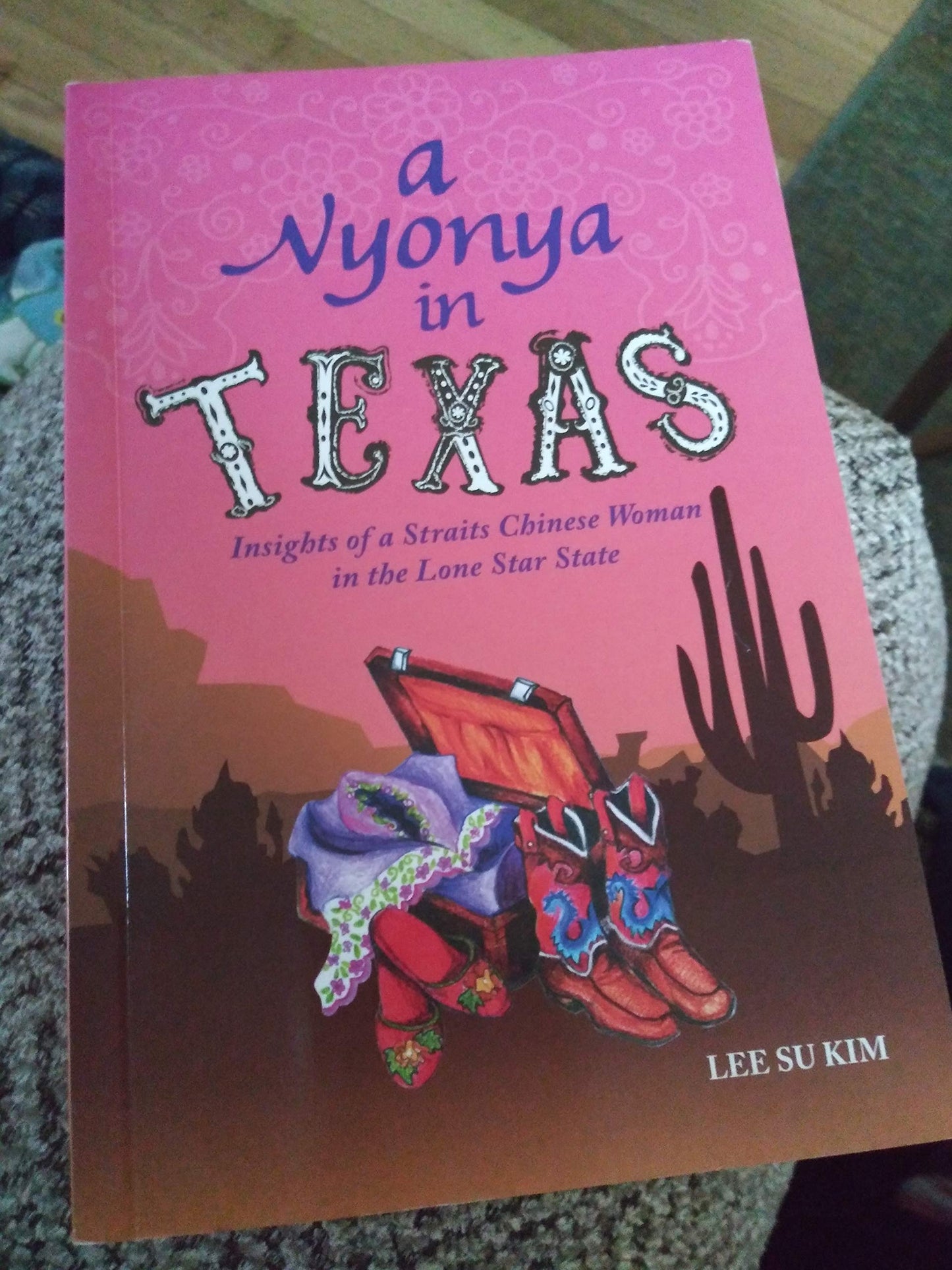 Book cover of A Nyonya in Texas by Lee Su Kim