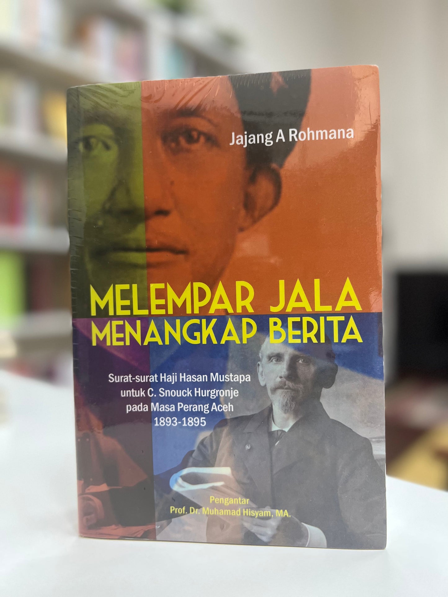 Book cover of Melempar Jala Menangkap Berita by Jajang A Rohmana