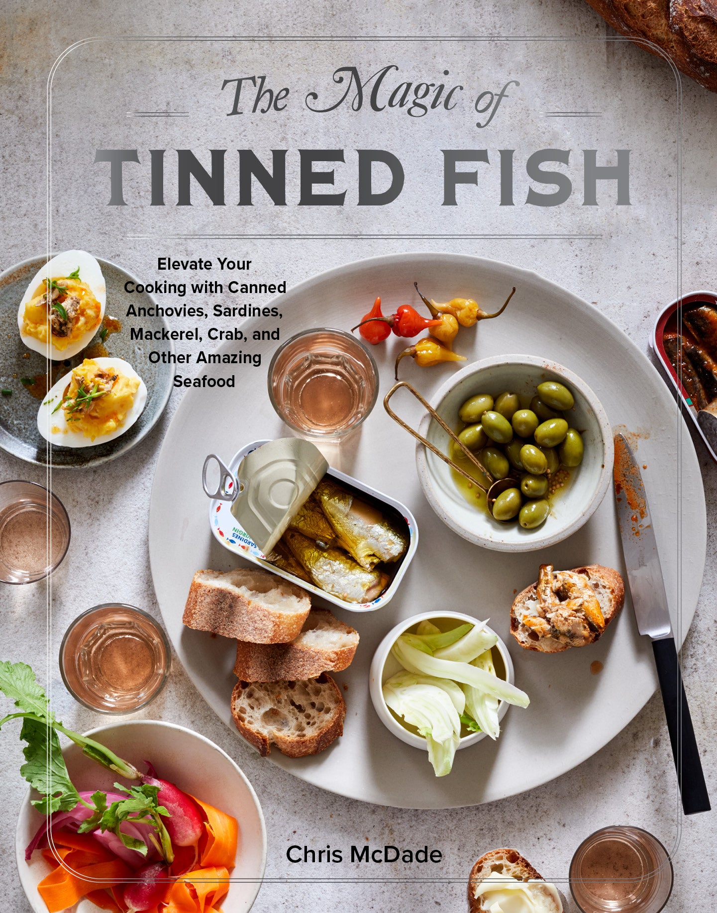 Book cover of The Magic of Tinned Fish: Elevate Your Cooking with Canned Anchovies, Sardines, Mackerel, Crab, and Other Amazing Seafood by Chris McDade