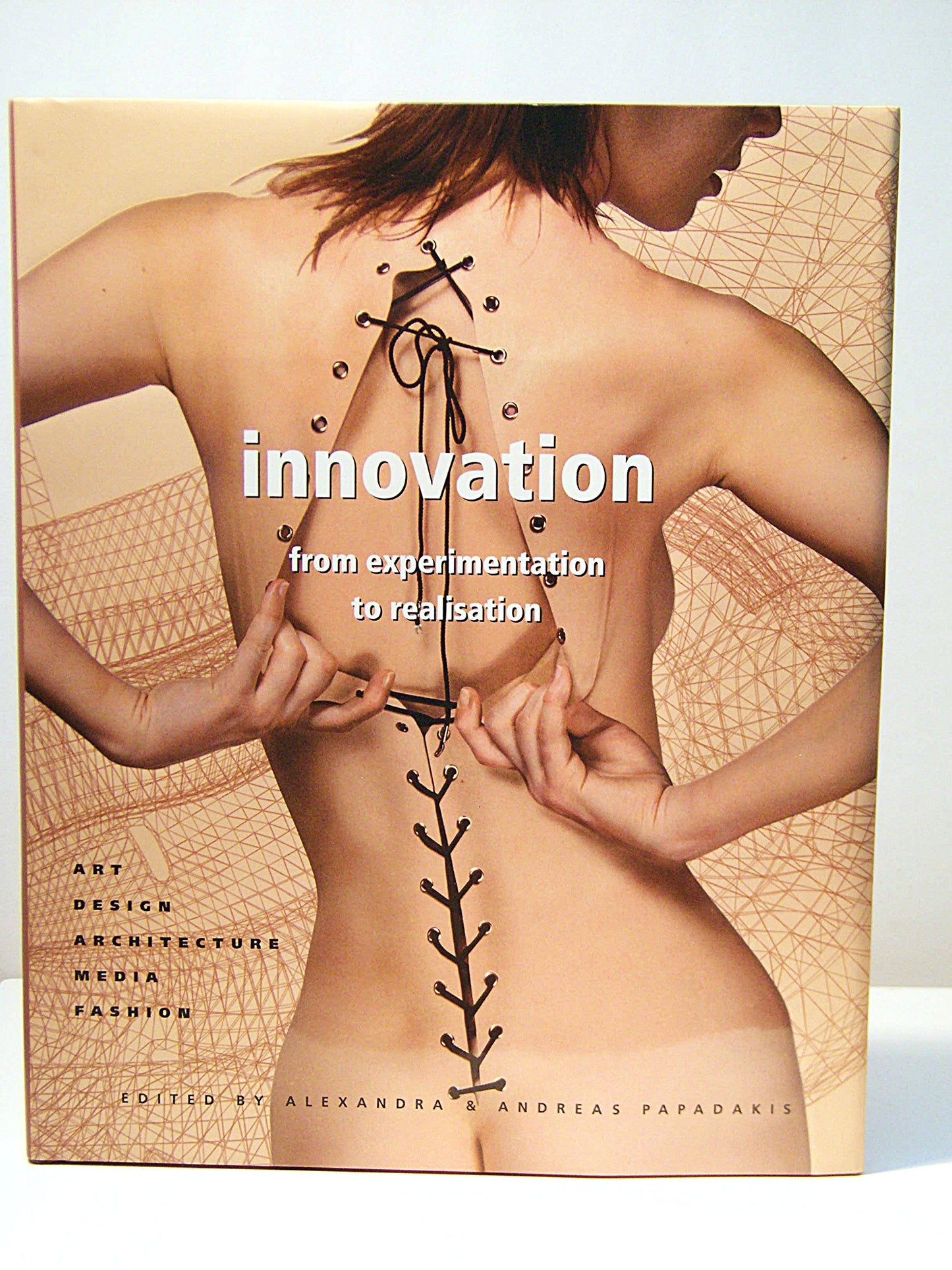 Book cover of Innovation: From Experimentation To Realization - Art, Design, Architecture, Media, Fashion by Andreas Papadakis (Ed.), Alexandra Papadakes (Ed.)