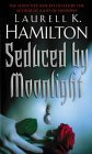 Book cover of Seduced By Moonlight by Laurell K. Hamilton