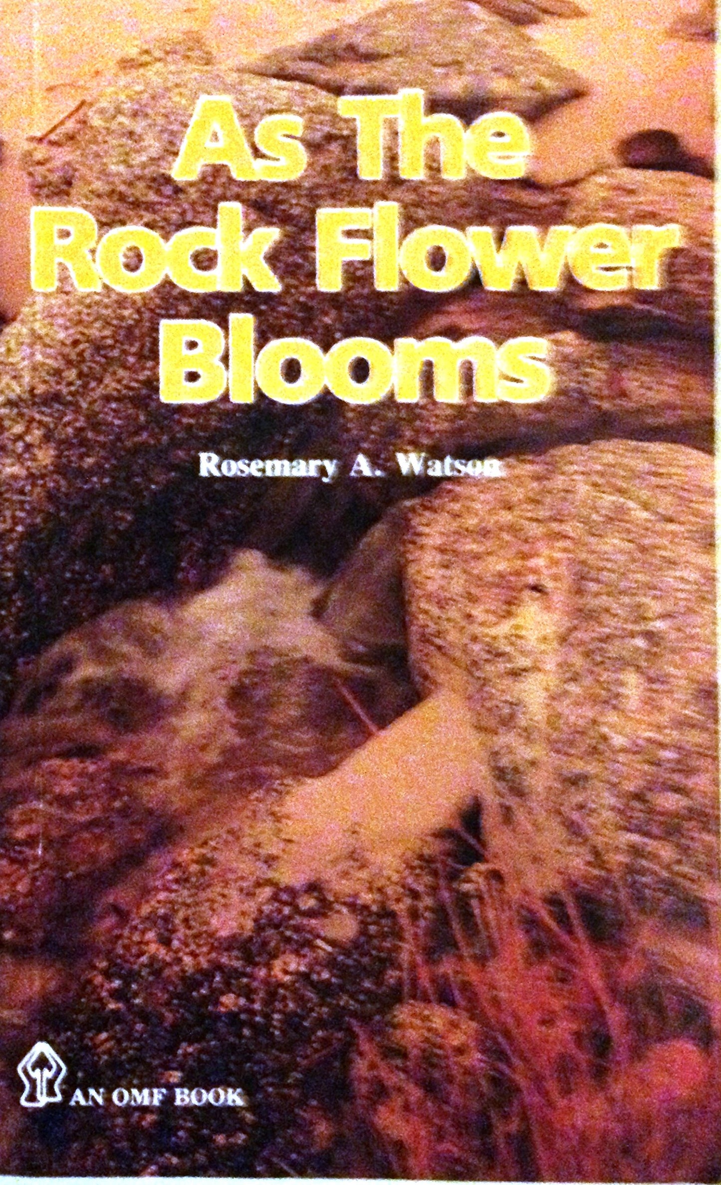 Book cover of As The Rock Flower Blooms by Rosemary A. Watson